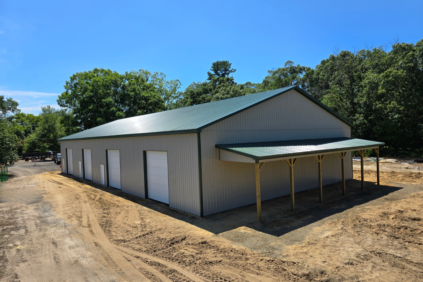 Green roof and gray side corner of 60x120 Commercial Pole Barn in Williamstown NJ
